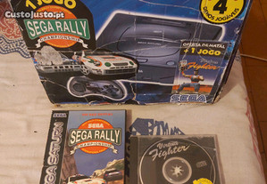Sega Saturno com caixa e jogos.